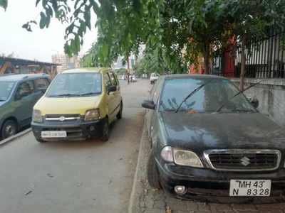 cars parked on footpath