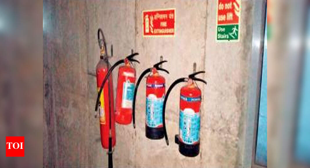 Fire extinguishers used as barricades back on multilevel parking lot