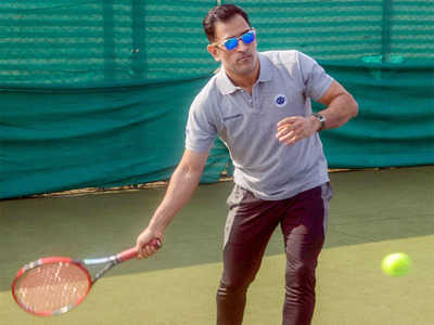 MS Dhoni switches the bat for a racquet | Off the field News - Times of ...