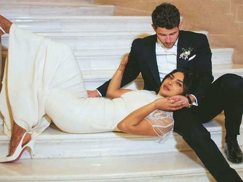 Nick Jonas Removing Priyanka Chopra's Garter After Wedding is The Cutest  Thing Ever