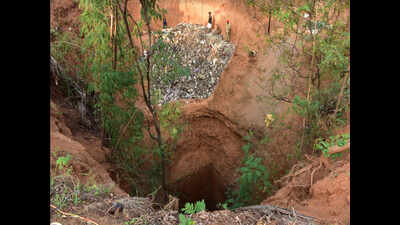 Police digging a well to retrieve skeletal remain