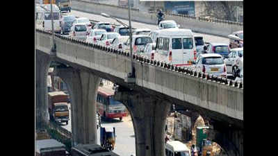 Bengaluru: Vehicles crawl on E-City expressway as curbs imposed