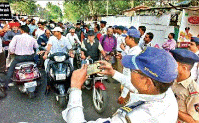 On day of protests, police turn the heat on over 9,500 riders without helmets on roads
