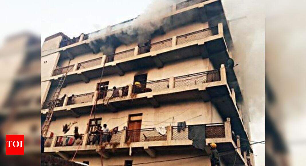 Police rescue 25 people from burning building | Delhi News - Times of India