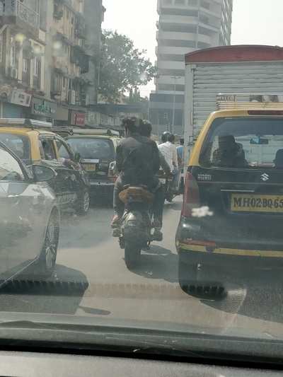riding without a helmet and a registration plate