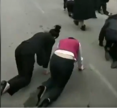 Employees in China made to crawl on road for failing to meet targets