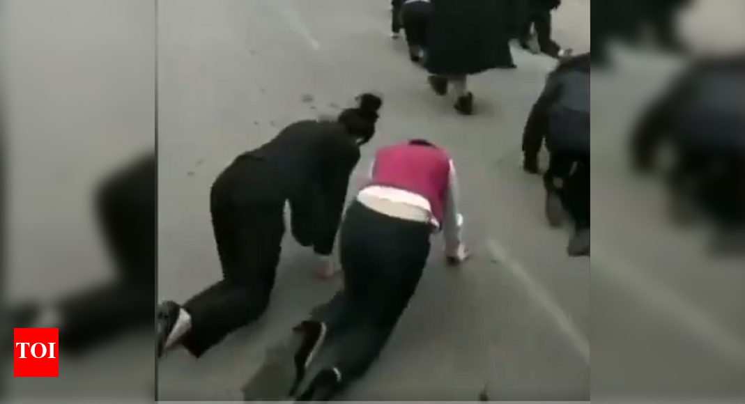 Employees in China made to crawl on road for failing to meet targets