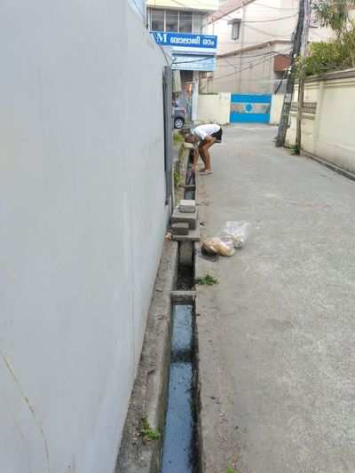 gutter not covered and locals dumping waste