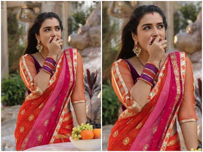 Photo: Amrapali Dubey relishes on some fresh fruits as she poses in a saree