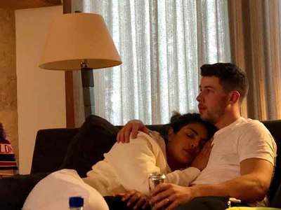 PeeCee sleeps on Nick's shoulder, trolls ask, 'who's taking the picture?'