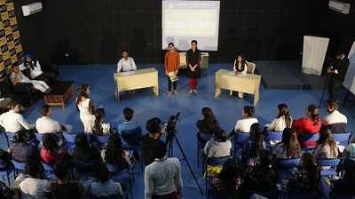 Students participate in a panel discussion on Budget