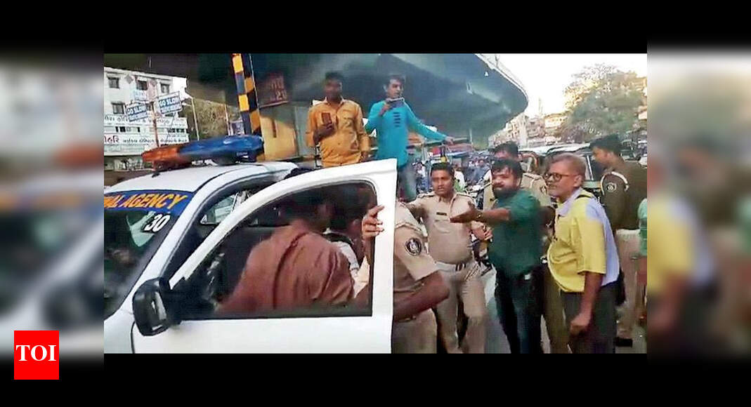 Two arrested for beating up traffic cop | Surat News - Times of India