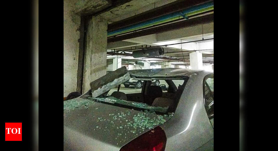 Ceiling falls on car at basement | Noida News - Times of India