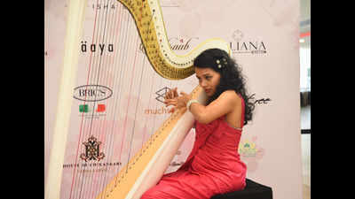 Harpist Megan enthrals the audience with her rendition at Express Avenue