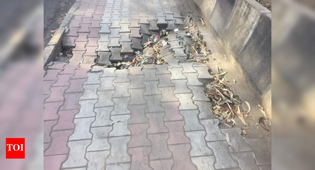 Damage footpath - Times of India