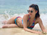 Bikini-clad Claudia Ciesla soaks up the sun on Mahe islands