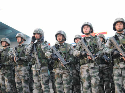 China defends heavy defence spending, hints at further rise - Times of ...