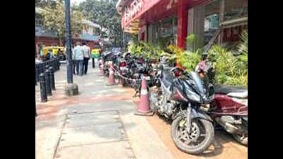 Bengaluru: Police crack down on footpath parking, tow away 150 vehicles