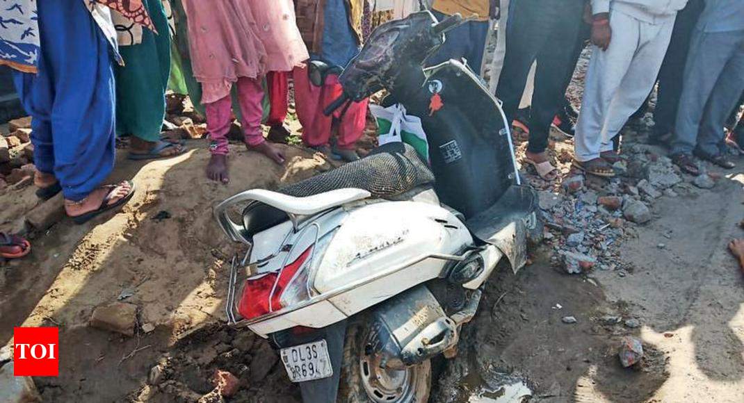 Woman falls off scooter, crushed by truck in Greater Noida | Noida News -  Times of India