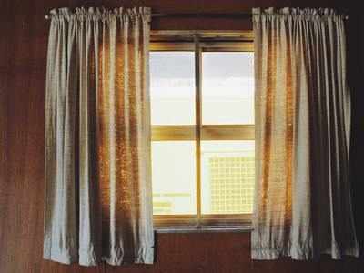 Beat the summer heat with sun-blocking curtains and blinds