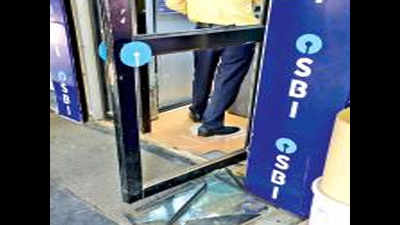 Man breaks glass door of SBI ATM booth