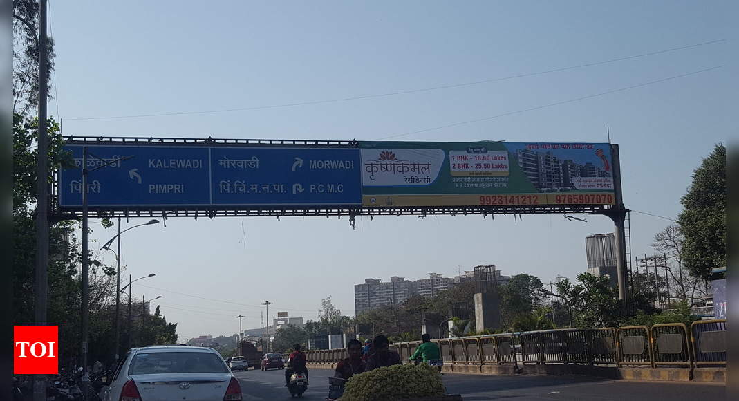 Advertisement on sign board - Times of India