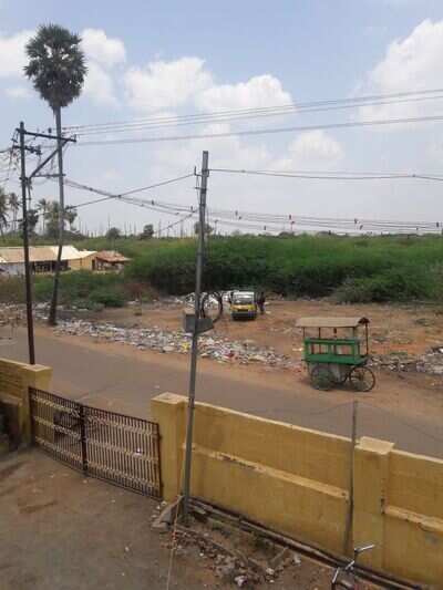 POURING THE GARBAGE OPPOSITE TO LIVING AREA - Times of India