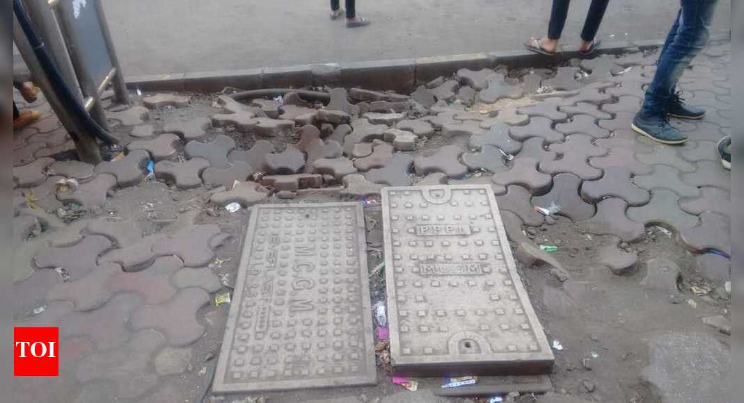 FOOTPATH DAMAGE DUE TO PUBLIC DUSTBIN - Times of India