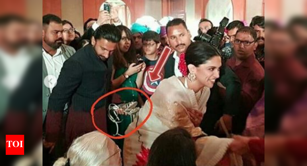 Ranveer Singh Holds Wife Deepika Padukones Heels At A Wedding And Its