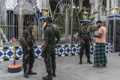 Defence secretary steps down as Sri Lanka steps up security across island nation