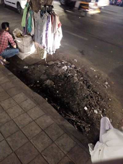 Garbage removed from drain lying