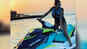 Malaika Arora flaunts her curvacious body on water bike! 