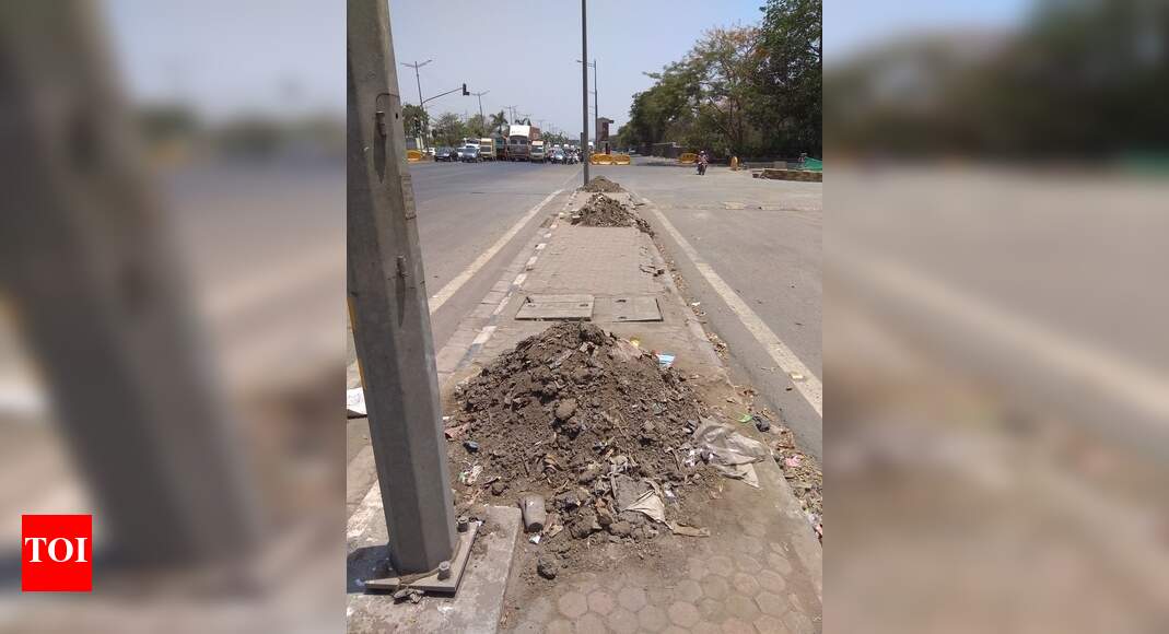 Heap of muck awaiting to.be removed Times of India