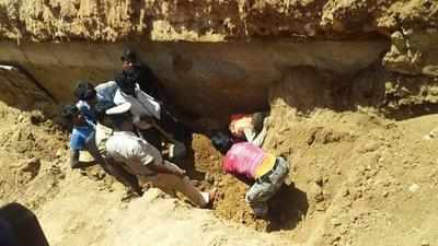 Three buried under soil, die