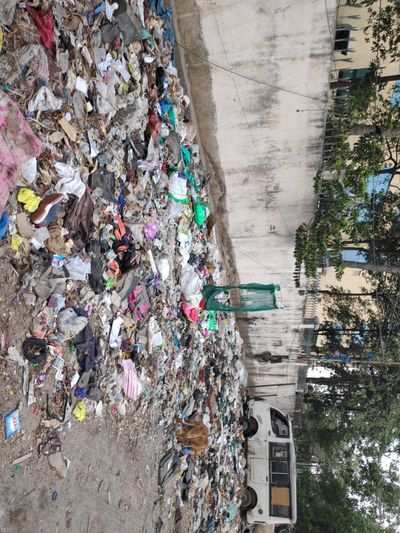 overflow of garbage behind prominent Tech Park