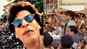 Watch: Shah Rukh Khan gets on the rooftop of his car, surprises fans outside his residence