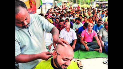35 ex-employees of 108 emergency service shave their heads in protest