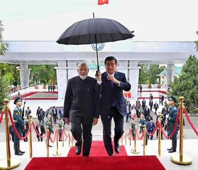 Photo Of PM Modi Holding A Jio Umbrella Is Satire