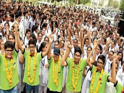 JEE-Advanced toppers from Allen Career Institute celebrating at Kota on Friday