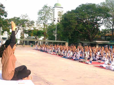 City students perform asanas to mark International Day of Yoga