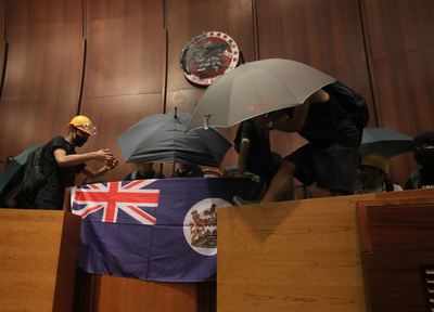 Hong Kong Protesters Smash Up Legislature In Direct