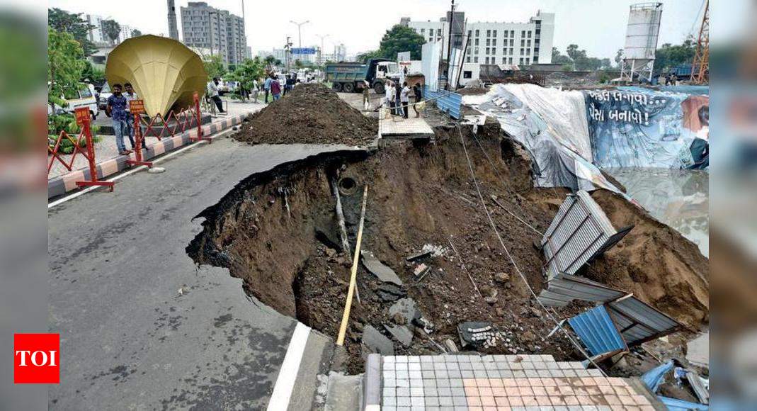 Service road caves in on VIP Road | Surat News - Times of India