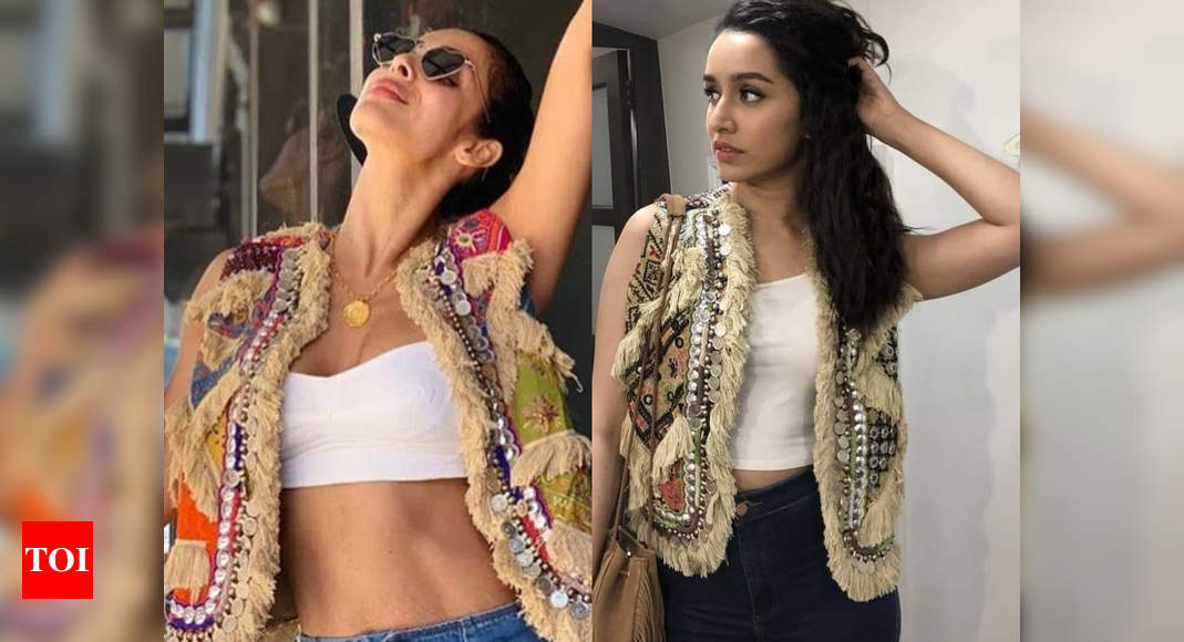 Malaika Arora looks ultra chic in white crop top and bell-bottom jeans: In  Pics, News