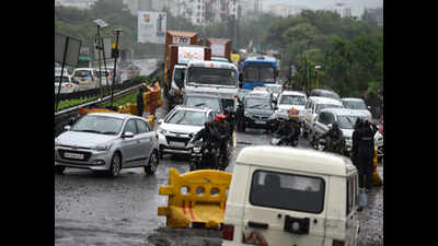 Heavy showers, waterlogged roads and potholes throw traffic out of gear