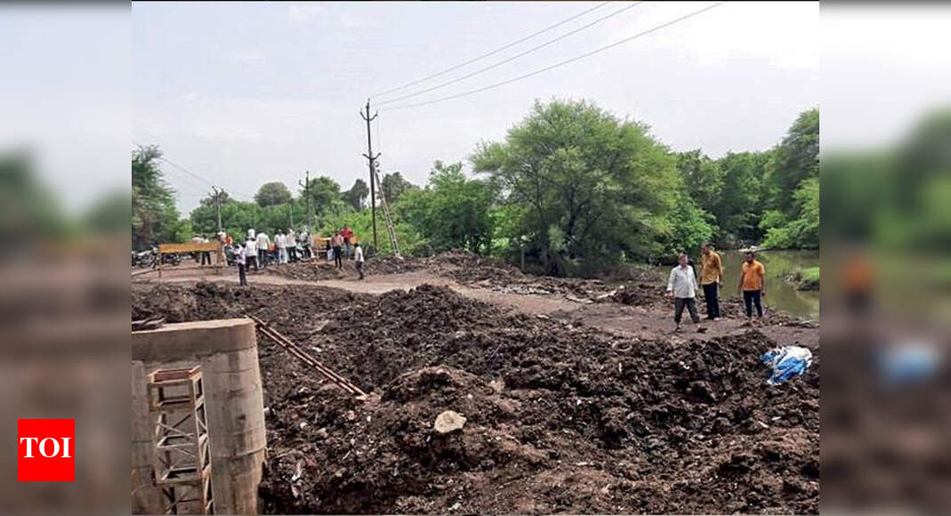Fed up with government delay, villagers rebuild road washed away by ...