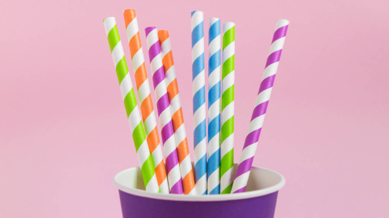 Replacing plastic drinking straws with metal straw concept. Woman