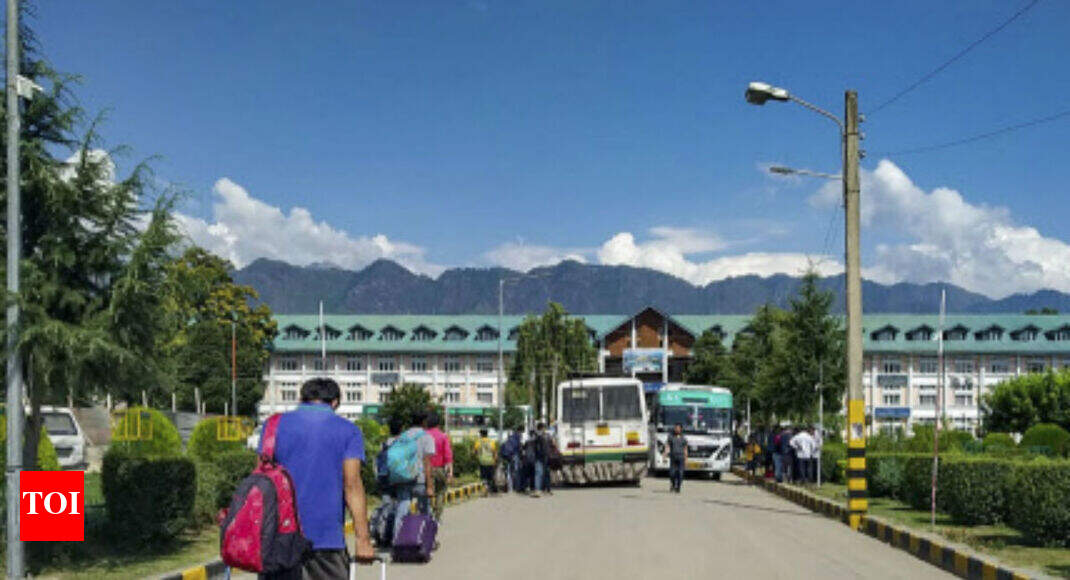 J&K tense as troops arrive, tourists depart