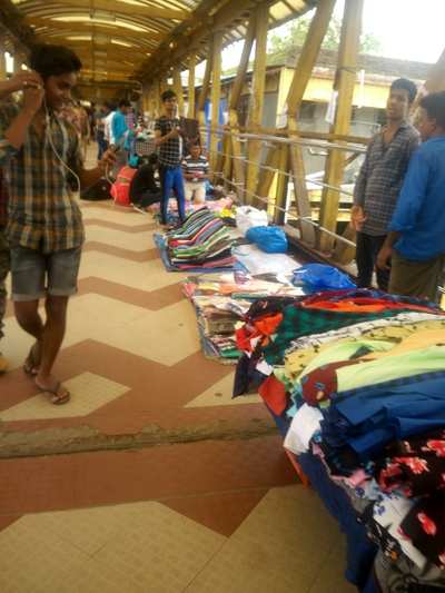 Encroachment of sellers on bridge near station
