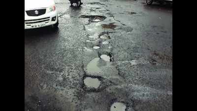 Rain riddles road with potholes, monsoon commute turns risky