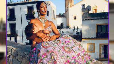 Asian beauty Shayoon Mendeluk breastfeeds son donning magnificent traditional attire
